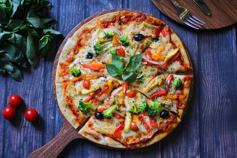 Artisan pizzas freshly made at a deweys pizza catering event